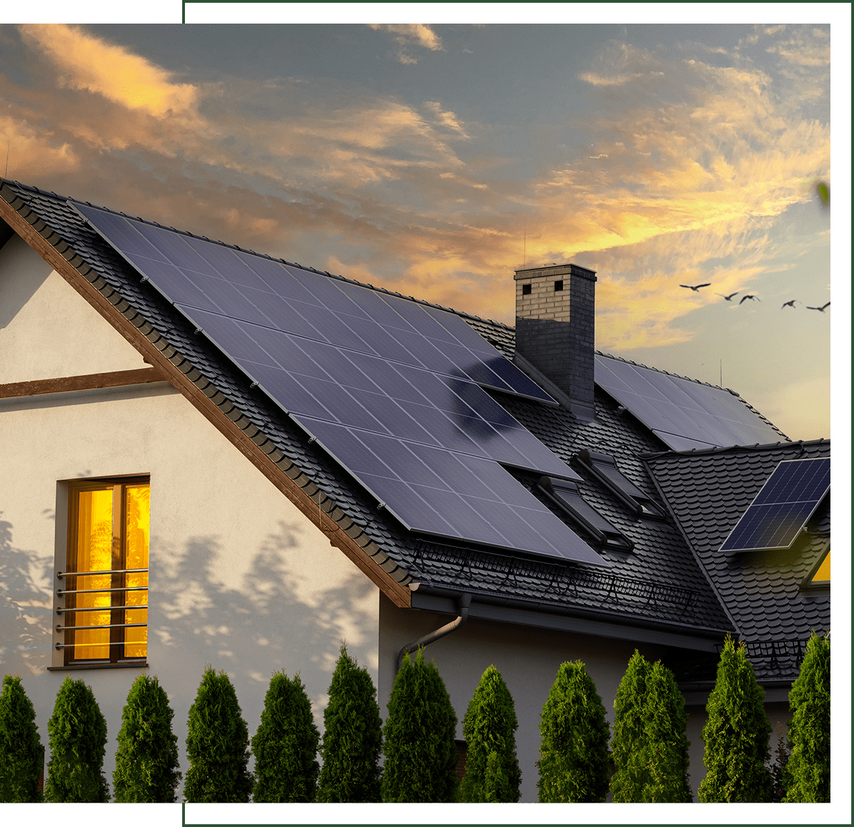House with solar panels at sunset.