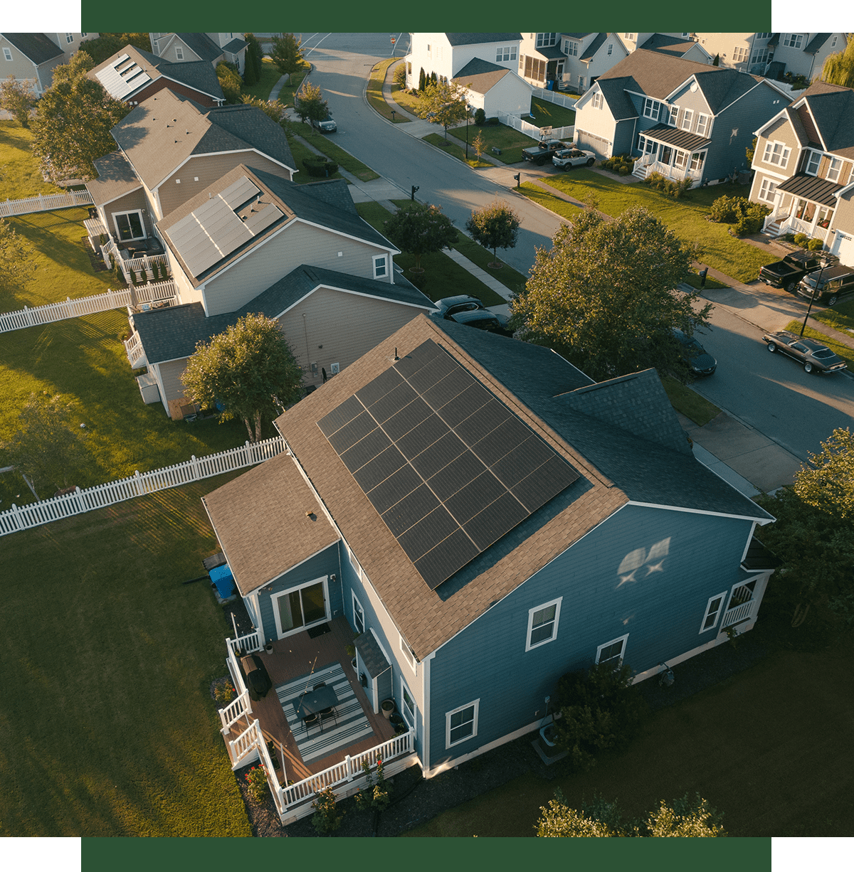 Houses with solar panels in suburban neighborhood.