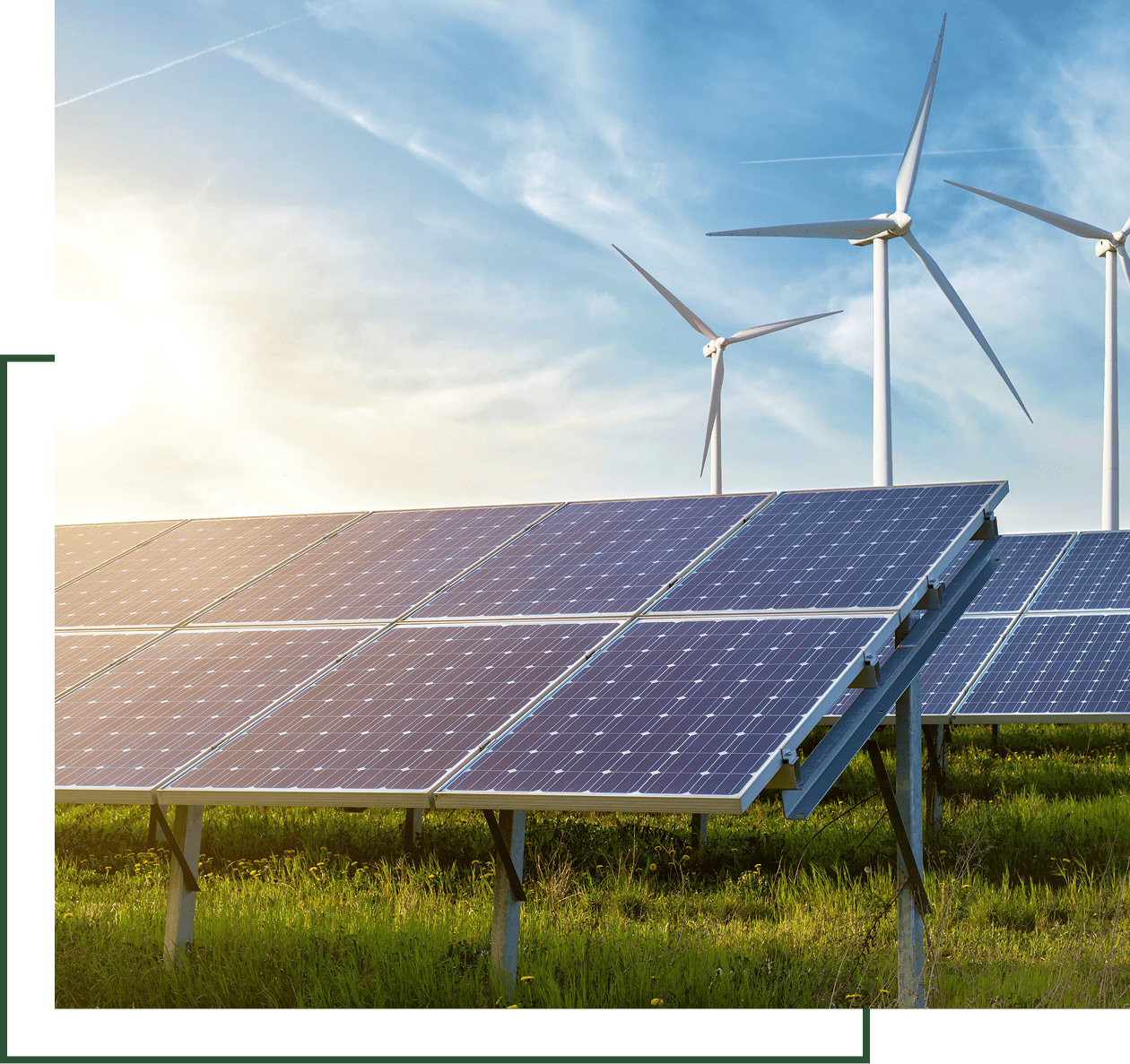 Solar panels and wind turbines in field.